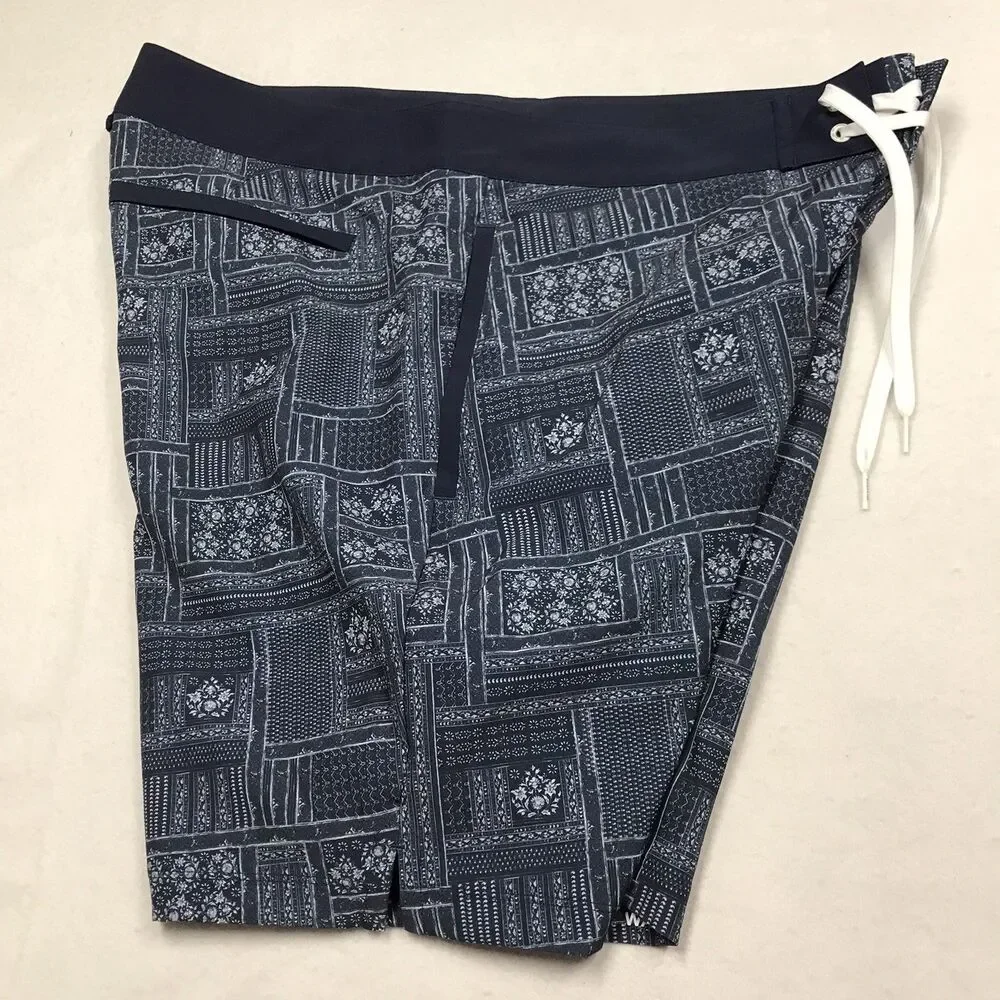 RHONE R&R Swim Trunks Men 38 Blue Floral Print Poly Stretch Mesh Lined